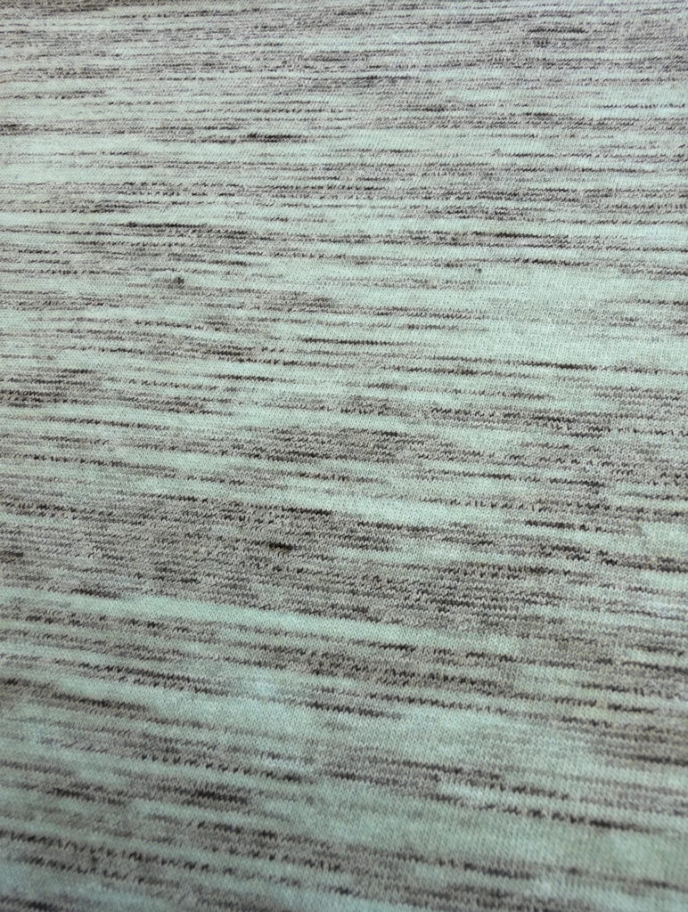 Mint marble jersey knit fabric close-up